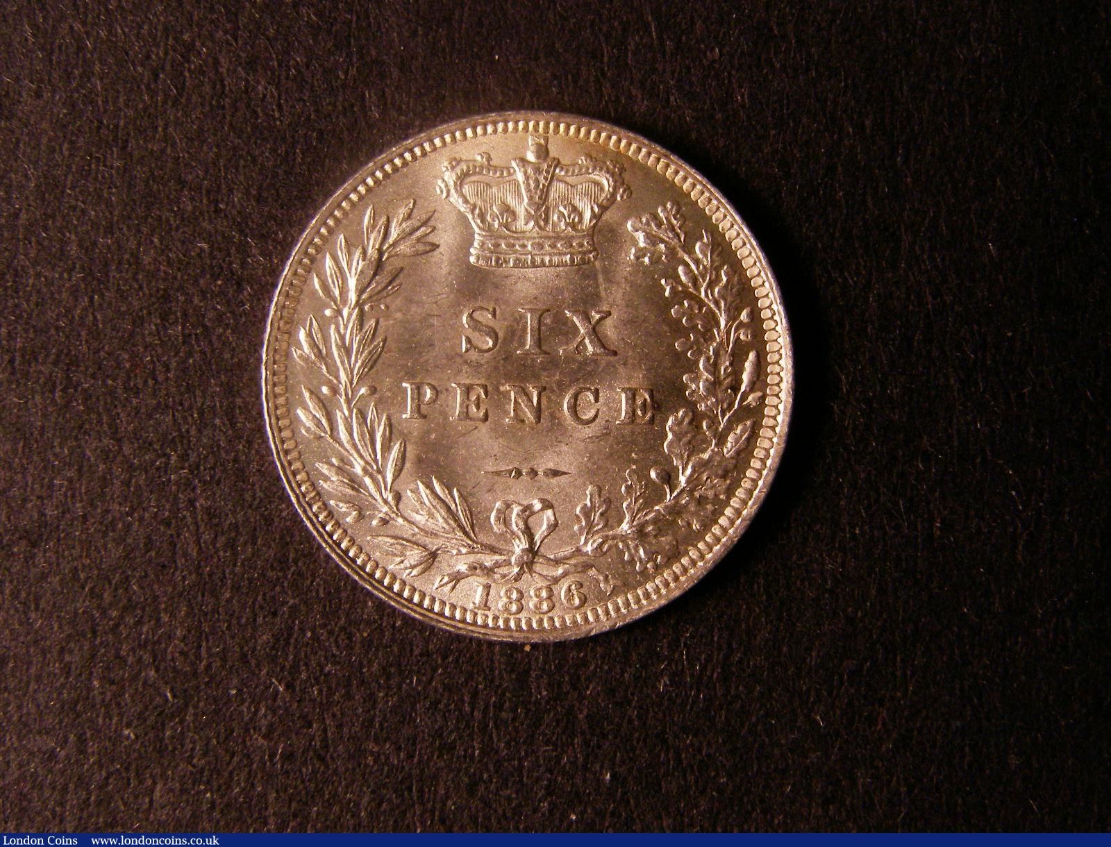 London Coins : A124 : Lot 943 : Sixpence 1886 ESC 1748 UNC with a couple of small tone spots on the obverse