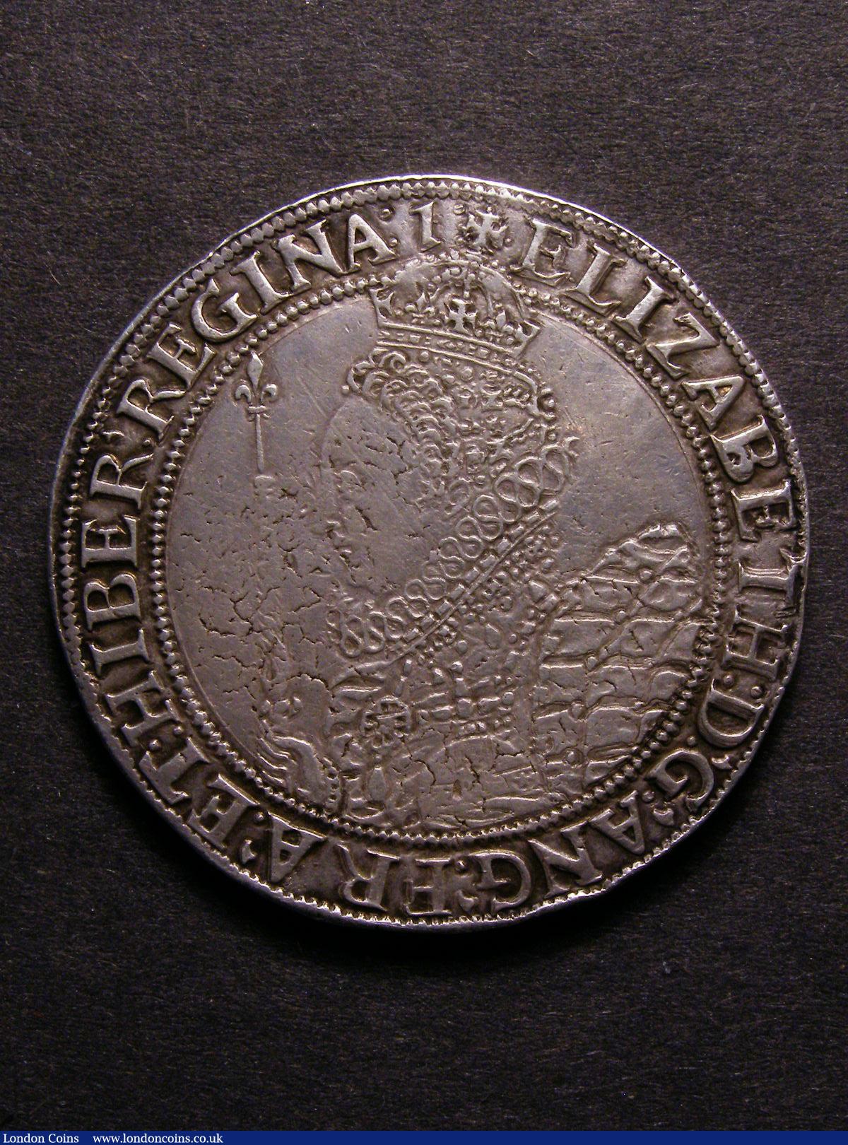 Crown Elizabeth I mint mark 1 bold VF drapery particularly sharp, some stress lines as often, the reverse has a small TB stamped in the fourth angle which does not encroach noticeably on the design in the style of Tudor letters so presumed contemporary, this slight distraction is more than compensated by the price estimate without these marks this would very likely be a £4,000-£6,000 item : Hammered Coins : Auction 128 : Lot 872