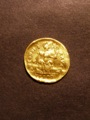 London Coins : A129 : Lot 1022 : Roman Gold Solidus Honorius (393-423 AD)  Obverse DN HONORIVS PF AVG helmeted and cuirassed bust fac...