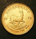 London Coins : A133 : Lot 1469 : South Africa Krugerrand 1974 KM#73 UNC or near so with a chemical deposit on the reverse