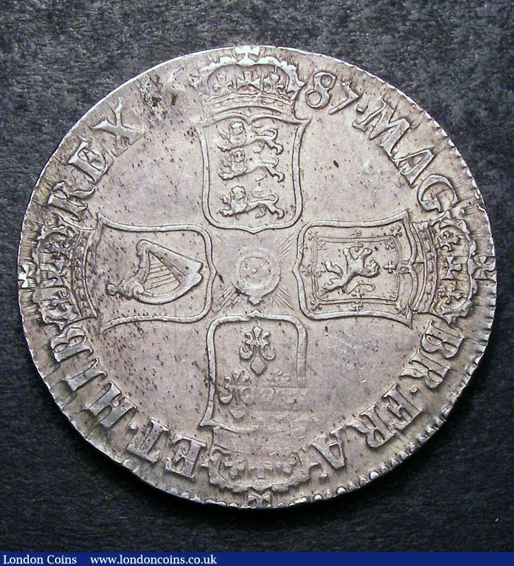 London Coins : A133 : Lot 235 : Crown 1687 TERTIO ESC 78 EF or near so with some haymarking and some weakness at the top of the wrea...