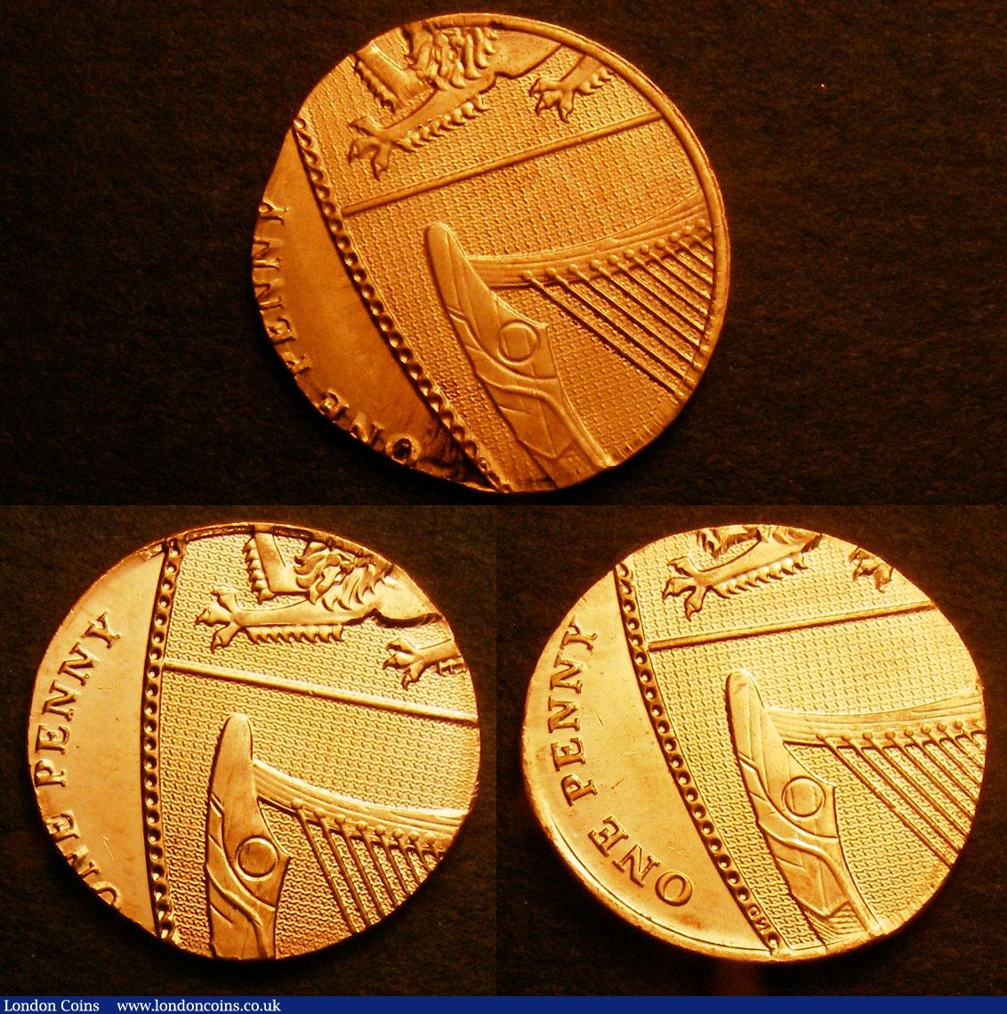 London Coins : A140 : Lot 1287 : Mint Errors (3) Mis-Strikes Decimal One Pennies 2011 (3) struck of slightly oval flans off-centre UN...