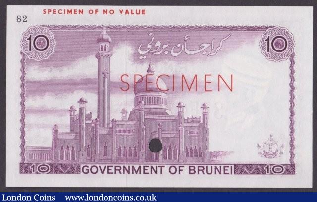 London Coins : A140 : Lot 423 : Brunei 10 ringgit issued 1967, purple colour trial No.82, SPECIMEN ovpt. & one punch-hol...