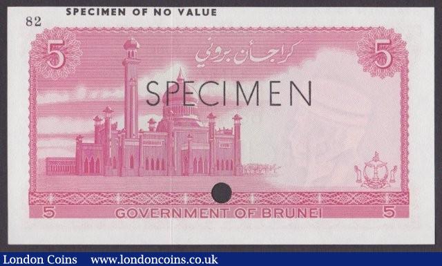 London Coins : A140 : Lot 427 : Brunei 5 ringgit issued 1967, red colour trial No.82, SPECIMEN ovpt. & one punch-hole, Pick2ct, ...