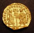 London Coins : A147 : Lot 1798 : Roman Gold Solidus Magnentius (350-353AD) Reverse Victory and Liberty standing facing each other, ho...