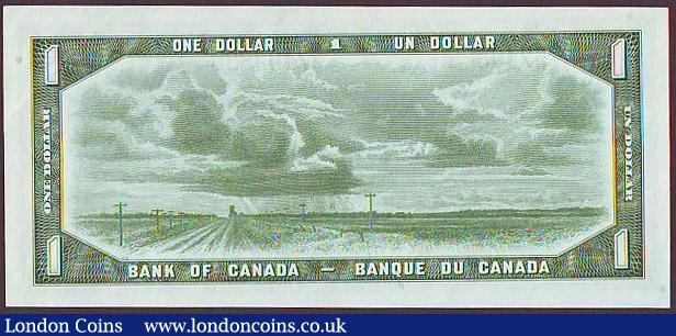 London Coins : A148 : Lot 196 : Canada $1 dated 1954, QE2 portrait at right, series L/A 7493836, "Devils Face" signed Beat...