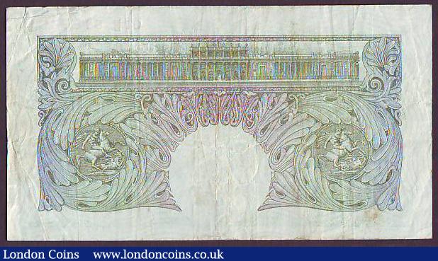 London Coins : A149 : Lot 105 : One pound Peppiatt B238 issued 1934, the very 1st run, series 01B 818083, 2 pinholes, Fine and a ver...
