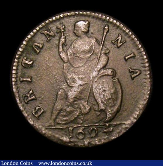 London Coins : A152 : Lot 2076 : Farthing 1694 No stop on Reverse Peck 618** VF for wear but with uneven surfaces, slabbed and graded...
