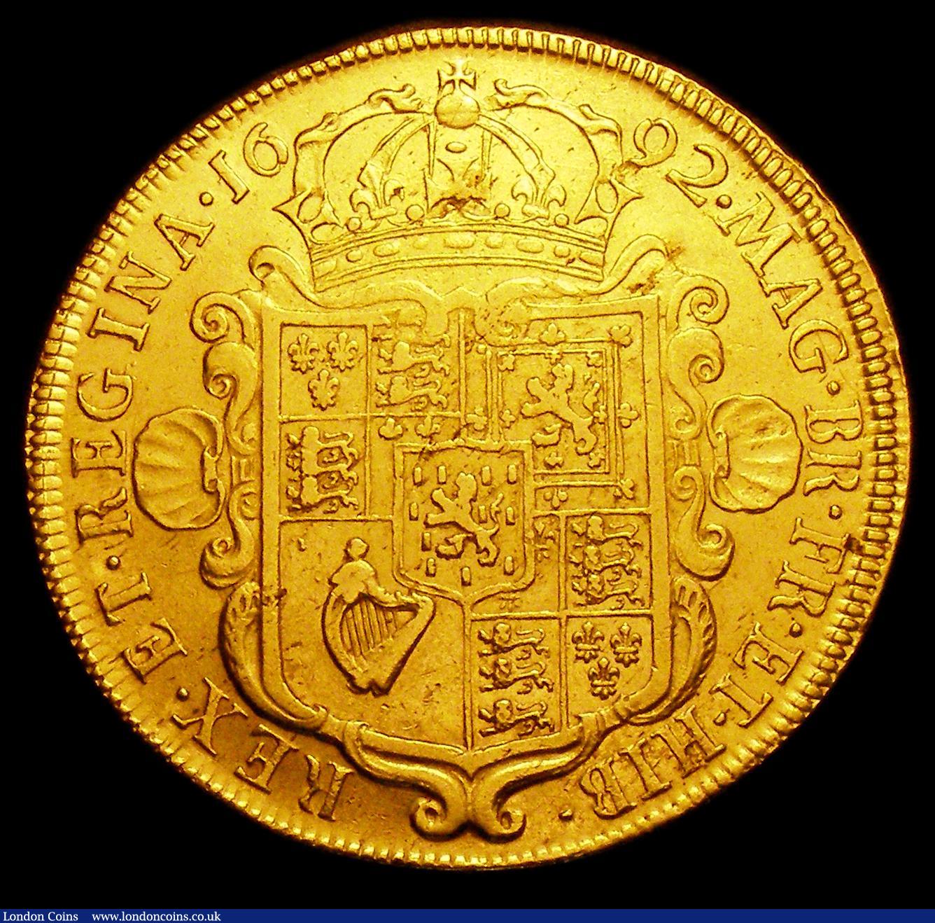 London Coins : A154 : Lot 1943 : Five Guineas 1692 QVARTO edge S.3422GVF/VF for wear, the obverse with a die flaw in the right field ...