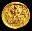 London Coins : A154 : Lot 1532 : Au solidus.  Theodosius II.  C, 402-450 AD, Constantinople.  Obv: D N THEODO - SIVS P F AVG; Helmete...