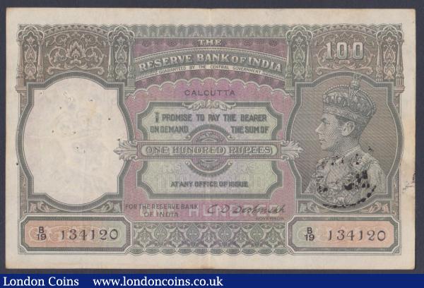 India 100 rupees KGVI issued 1943 series B/19 134120, Calcutta branch, signed Deshmukh, Pick20e, multiple pinholes at left & bank stamp reverse, Fine+ : World Banknotes : Auction 155 : Lot 1881