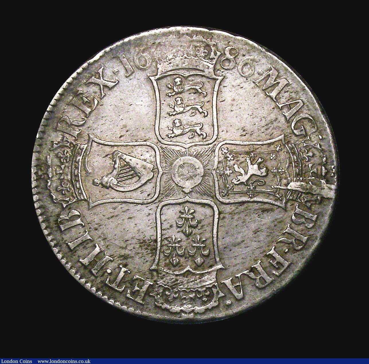 London Coins : A155 : Lot 559 : Crown 1686 SECVNDO No Stops on Obverse ESC 77 GVF and attractively toned with some haymarking, the r...