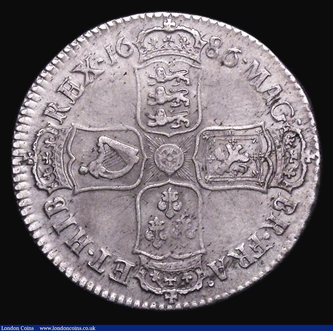 London Coins : A155 : Lot 590 : Halfcrown 1686 SECVNDO ESC 494 VF with a series of thin scratches visible under magnification, and s...