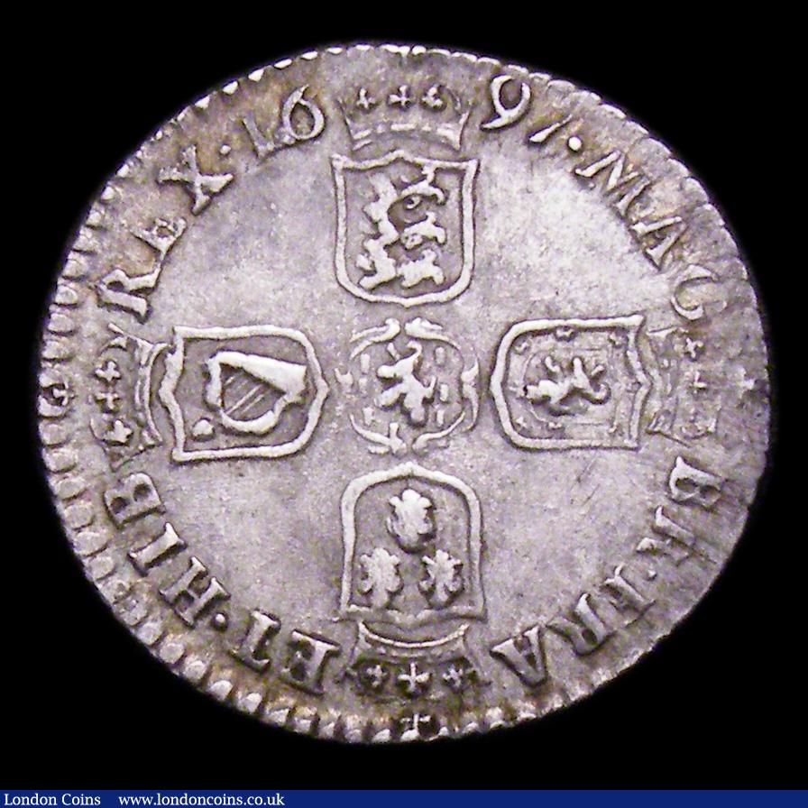 London Coins : A155 : Lot 669 : Sixpence 1697B First Bust, Later Harp, Small Crowns ESC 1155 NEF toned