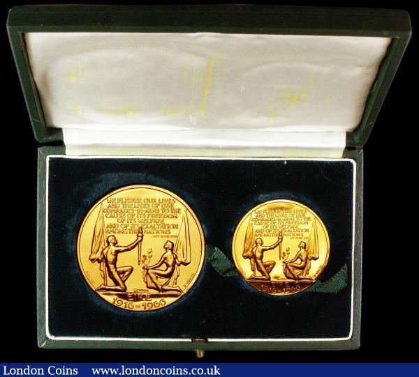 Ireland - Republic Padraig H. Pearse 1879-1916 boxed commemorative medal two piece set (50mm and 36mm diameters) in 22 carat gold by Paul Vincze 1966, 1916 - 1966 50 years anniversary of Easter Rising PADRAIG H PEARCE 1879 - 1916 surrounding right facing portrait obverse WE PLEDGE OUR LIVES AND THE LIVES OF OUR COMRADES IN ARMS TO THE CUASE OF ITS FREEDOM OF ITS WELFARE AND OF ITS EXALTATION AMONG THE NATIONS reverse above two figures holding flags, total weight 189 grams so over 5 1/2 ounces pure gold content so the gold value alone in the region of £6,000 but rare as medals especially this large double gold issue, we were unable to find any previous sales results for this rare two coin set. Choice Unc in the two coin green display box with 1916 - 1966 in gold on the lid.   Paul Vincze also designed coins and is responsible for designs on coins from The Channel Islands, Rhodesia and Nyasaland, Nigeria and more : Medals : Auction 155 : Lot 2106