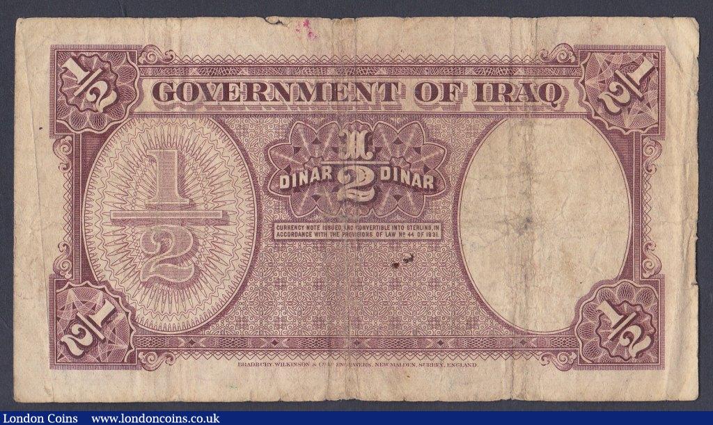 London Coins : A156 : Lot 181 : Iraq 1/2 dinar issued 1945 series K032676, Pick23a, small holes & edge nicks, surface dirt, VG t...