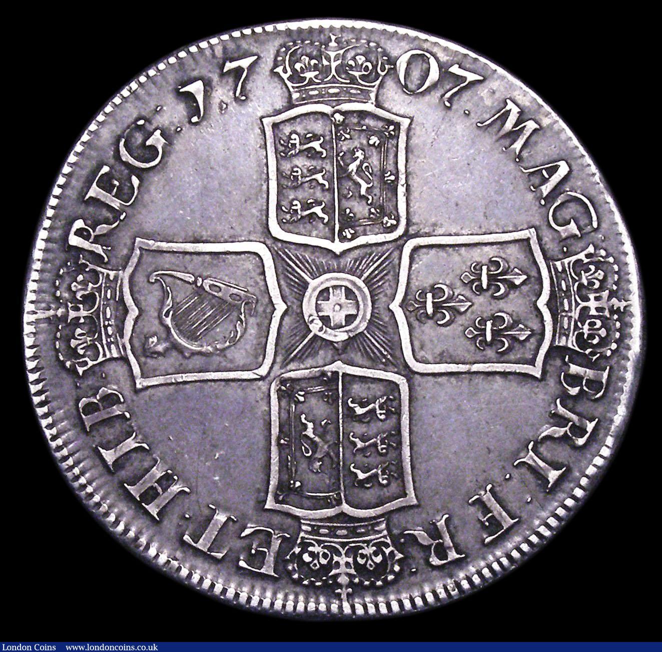 London Coins : A156 : Lot 1859 : Crown 1707E ESC 103 VF with a pleasing grey tone, the obverse with some contact marks behind the bus...