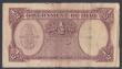 London Coins : A156 : Lot 181 : Iraq 1/2 dinar issued 1945 series K032676, Pick23a, small holes & edge nicks, surface dirt, VG t...