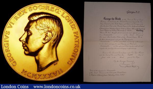 A Royal Society George VI medal 1945 by Royal Mint, 73mm diameter in  carat gold and weighing 298.18 grammes, UNC and lustrous,  presented to Dr Edward James Salisbury C.B.E. FRS, in original red leather presentation box, along with the original red leather folio containing an approval letter dated 9th November 1945 on Buckingham Palace notepaper, signed by the Keeper of the Privy Purse, also a CBE confirmation  letter with handwritten signature George R I, Dr Edward Salisbury's doctorate certificate from the University of Glasgow and an Honorary Freeman of the Worshipful Company of Gardeners of London certificate dated 19th November 1951, at the time the Director of the Royal Botanic Gardens, Kew, a most interesting group of related paperwork honouring Dr. Salisbury's achievements : Medals : Auction 157 : Lot 847