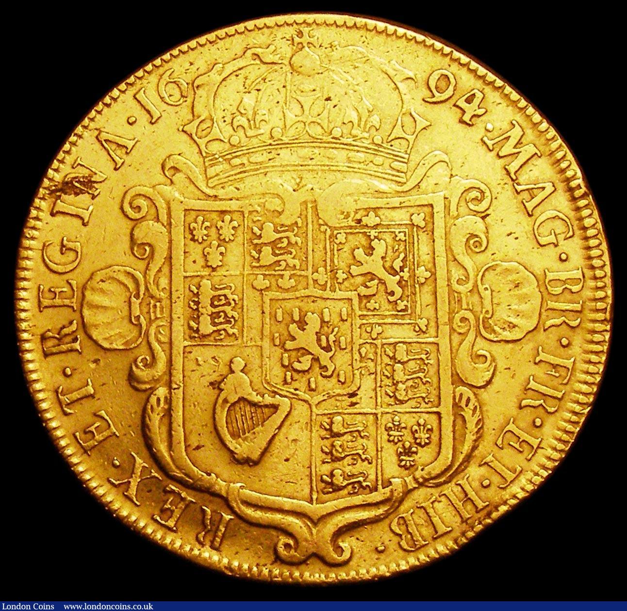 London Coins : A158 : Lot 1921 : Five Guineas 1694 SEXTO S3422 nVF/Fine bright with a very minor edge bruise and some metal faults or...