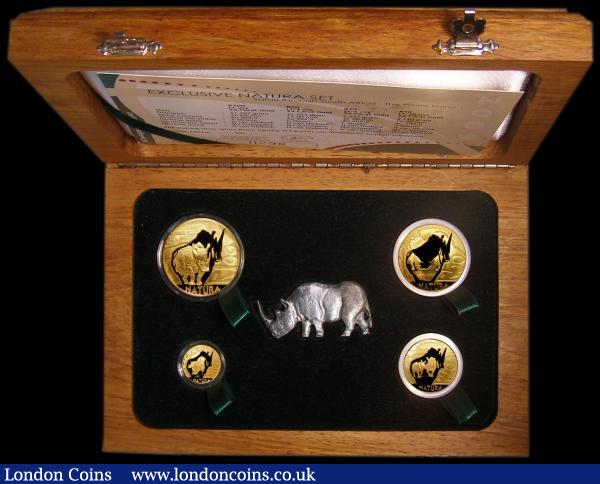 South Africa 2009 Natura Exclusive Set - The White Rhino a 4-coin set 100 Rand (One Ounce), 50 Rand (Half Ounce), 20 Rand (Quarter Ounce), 10 Rand (One Tenth Ounce) with the Rhino figurine, FDC in the wooden box of issue with certificate  : World Cased : Auction 161 : Lot 856