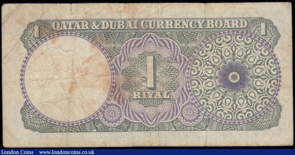 London Coins : A166 : Lot 379 : Qatar & Dubai Currency Board 1 Riyal Pick 1a ND (circa 1960's) serial number A/3 712531. Th...