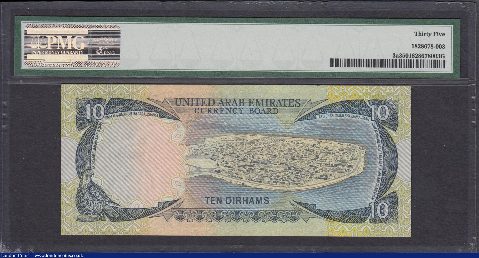 London Coins : A166 : Lot 467 : United Arab Emirates Currency Board 10 Dirhams Pick 3a ND (1973) serial number 14J 396806. The note ...