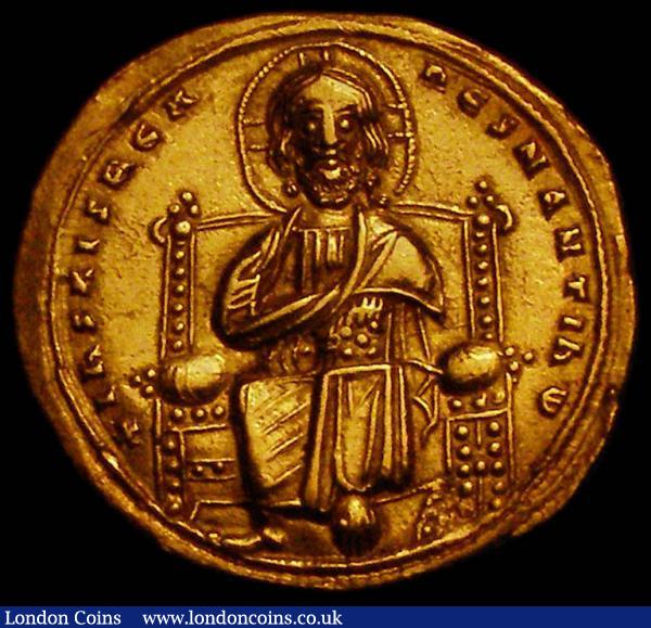 Byzantine Gold Histamenon Romanus III (1028-1034) Constantinople Mint +his XIS REX REGNANTInM Christ enthroned facing, nimbus cross behind head, holding book of gospels and raising right hand, double border / QCE bOHQ RWMAnW, Romanus on left, wearing a saccos and loros and holding cross on globe, with four dots on the fold of robe hanging below, being crowned by Mary, nimbate on right, MQ between their heads, double border. : Ancient Coins : Auction 167 : Lot 334
