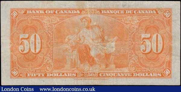 Canada Bank 50 Dollars Pick 63c dated Ottawa 2nd January 1937 serial number B/H 4822069 signatures Coyne & Rasminsky. A Canadian Banknote Company Limited printing in black on orange underprint featuring portrait of King George VI at centre on obverse. The reverse featuring allegorical figure. Very scarce higher denomination note sought after by many. Presentable and relatively crisp VF or near so : World Banknotes : Auction 167 : Lot 1456