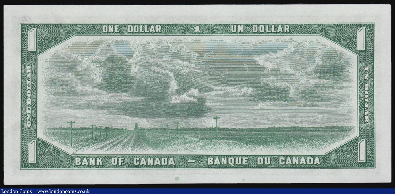 London Coins : A171 : Lot 89 : Canada $1 dated 1954, QE2 portrait at right, series L/A 7493836, "Devils Face" signed Beat...