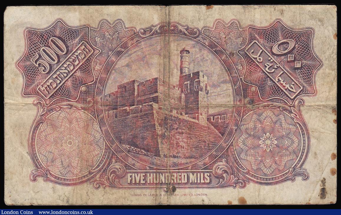 London Coins : A174 : Lot 125 : Palestine Currency Board 500 mils dated 20 April 1939 series F392826, Pick6c, about Fine with some s...