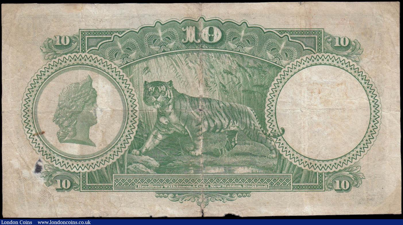 London Coins : A175 : Lot 147 : Straits Settlements 10 Dollars Pick 18b dated 1st January 1935 serial number C/15 48330 signed Rex C...