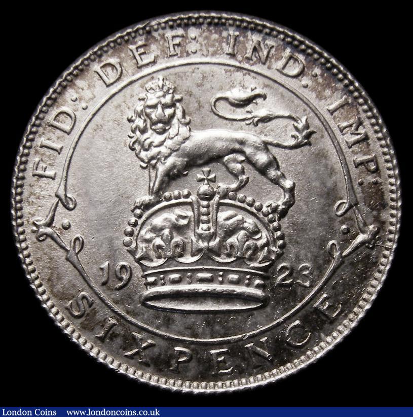 London Coins : A175 : Lot 1812 : Sixpence 1923 ESC 1809, Bull 3886 UNC and lustrous, touches of blue, gold and cinnamon toning furthe...