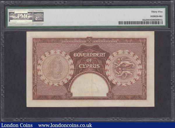Cyprus Government 1 Pound Pick 35a first date of issue for this type 1st June 1955 serial number A/3 049473 signature Denis John Mahony.  The reverse with numerical denomination in panel at left and Colonial Coat of Arms with 2 Lions in panel at right. Watermarked with an Eagle's head. In a PMG holder graded Choice VF 35 and an Exceptionally Scarce and very sought after note : World Banknotes : Auction 175 : Lot 99