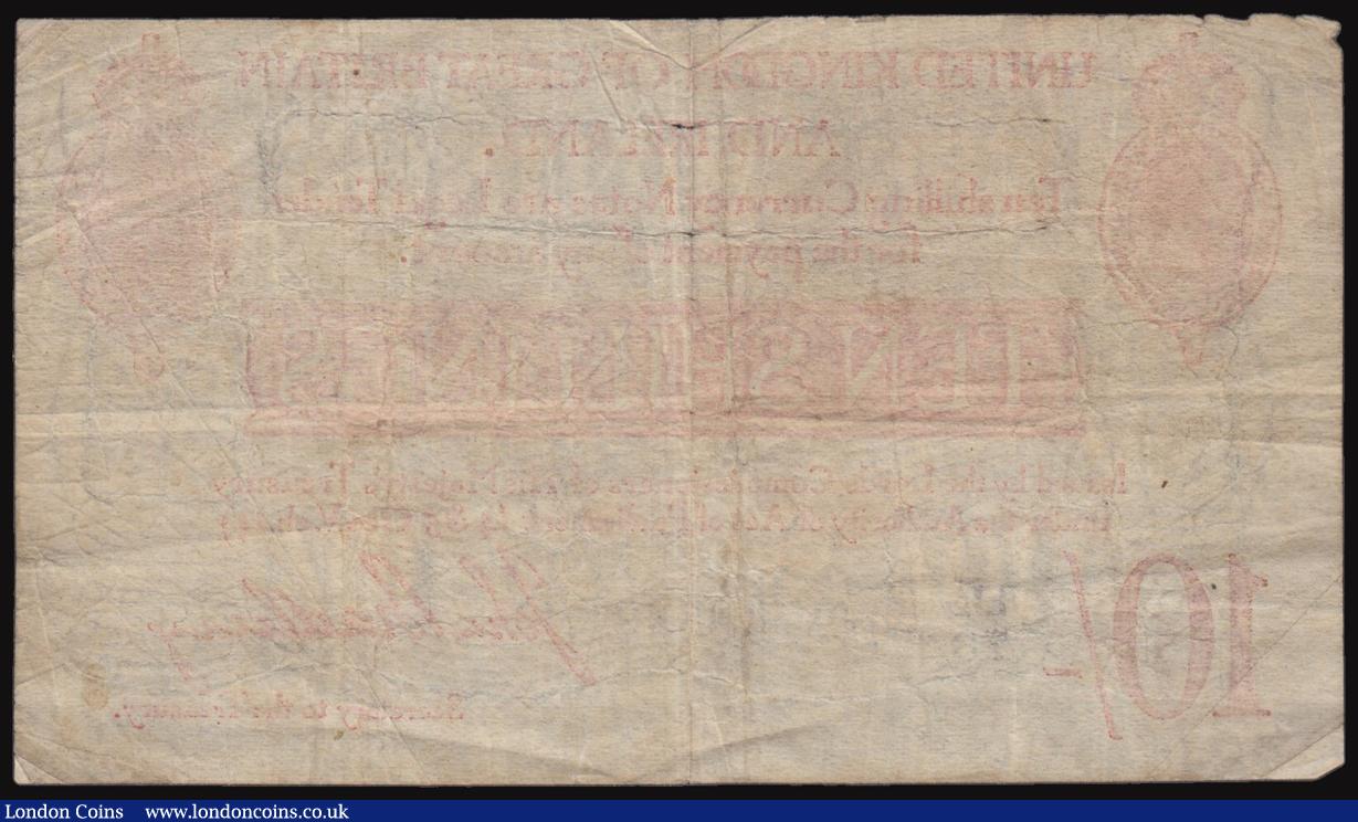 London Coins : A176 : Lot 35 : Ten Shillings Bradbury Type 3, Letter and 2, Serial No. B2/73 40532 some small pinholes, otherwise F...