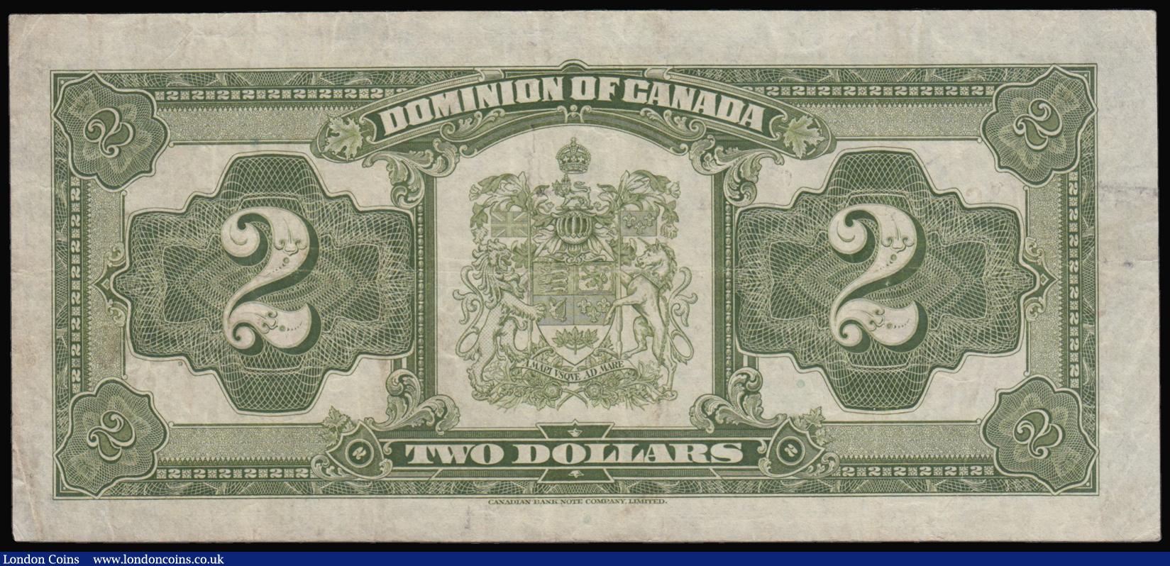 London Coins : A179 : Lot 105 : Canada 2 Dollars June 23rd 1923, Pick 34b red seal signed McCavour and Saunders some light dirt othe...