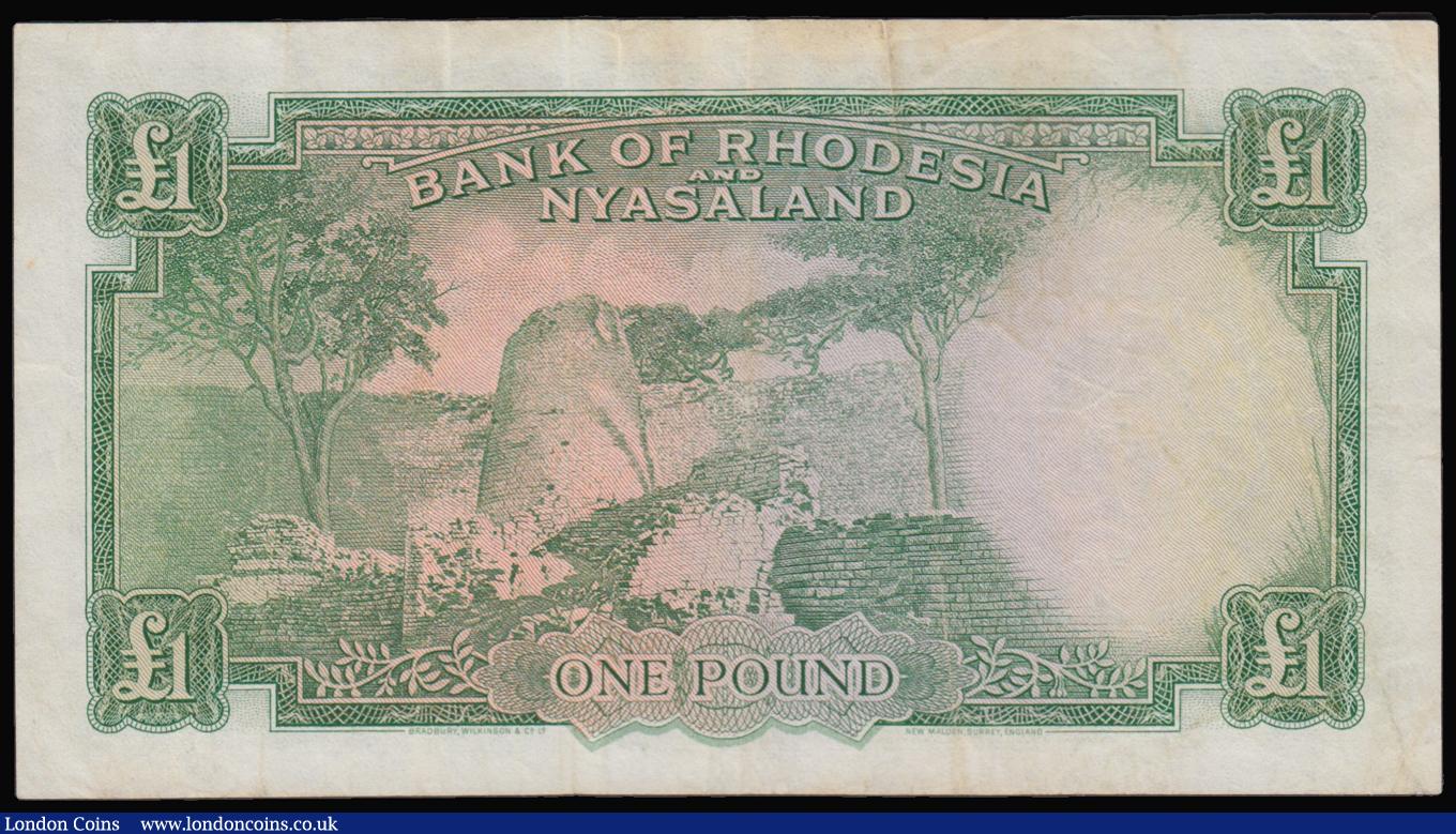 London Coins : A179 : Lot 177 : Rhodesia and Nyasaland One Pound 19/12/1960 issue, X/58 862630, Pick 21b VF with some folds and some...
