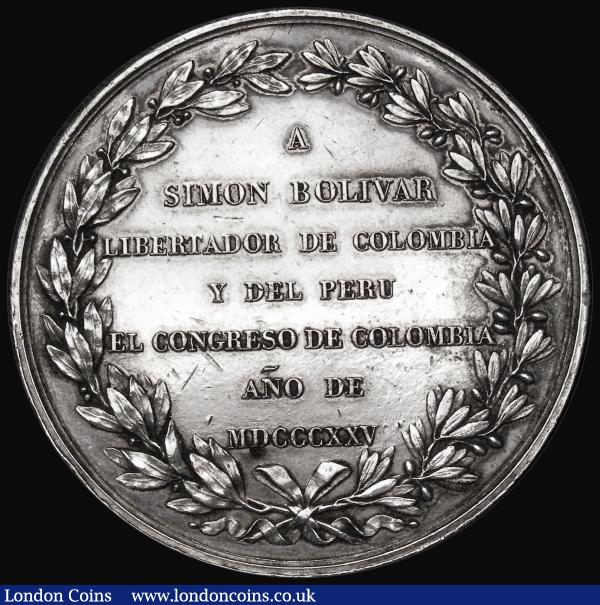 Colombia - Medal of Honour, dedicated by the congress to Simon Bolivar 1825, upon the victories at Junin and Ayacucho, 54mm diameter in silver by R.Gayrard, Obverse: Victory, standing right, holding a palm in her left hand and crowning the Genius of Freedom (standing left and holding rod topped by a Phrygian cap) with a laurel wreath held in her right; between them, a bundle of facses, JUNIN Y AYACUCHO VI DE AGOSTO Y IX DE DICIEMBRE DE MDCCCXXIV Exergue: GAYRARD F. Reverse: text in 7 lines, A / SIMON BOLIVAR / LIBERTADOR DE COLOMBIA / Y DEL PERU / EL CONGRESO DE COLOMBIA / AÑO DE / MDCCCXXV within olive and laurel wreath, 93.23 grammes, GVF with some rim nicks, lightly cleaned, an extremely rare medal, believed to be one of around 6-12 struck in silver, previous examples sold at auction are as follows:- 1. Adolph Weyl (April 1899, Lot 2460) [not illustrated] 2. The Alejandro Rosa specimen (Numismática: Independencia de América 1904, pg. 47, No. 48), 3. The Oscar Salbach specimen (Jacques Schulman February 1911, Lot 1838),  [not illustrated], 4. The Jose T. Medina specimen (Almanzar's April 1971, Lot 179). 5. The Alberto Lozano specimen (B&C Subastas, Bogota, July 2009, Lot 307), 6. The Fleury Heemsen specimen. Reportedly acquired from a private individual, who purchased it from Venezuelan collector Leopoldo Murillo, who in turn purchased it from an antiquarian in Santiago = Rodríguez-MYCC.14 Plate Piece. Certified AU55 by NGC.7. Künker Auction 349 (March 2021, Lot 6028). Certified SP65 by PCGS.8. Private Collection in Bogota. Illustrated on pg. 33 of Rodríguez's book (apparently a second example also exists in the same collection). : Medals : Auction 179 : Lot 854