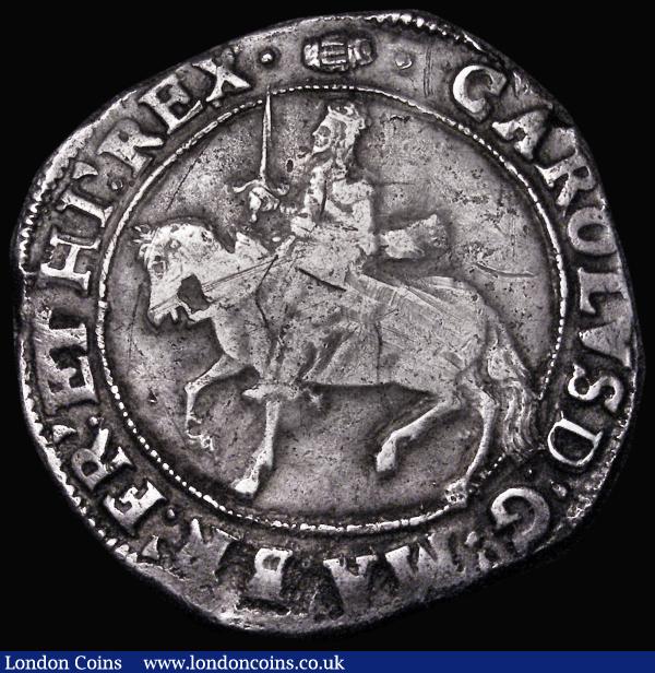 Halfcrown Charles I Group III, Third horseman, type 3a1, no caparisons on horse, scarf flies from King's waist, Reverse: Oval garnished shield, S.2773 mintmark Tun on obverse, reverse mintmark Tun overstruck, the underlying mark unclear, 14.80 grammes, Good Fine and bold, the obverse with some old scratches : Hammered Coins : Auction 181 : Lot 1389