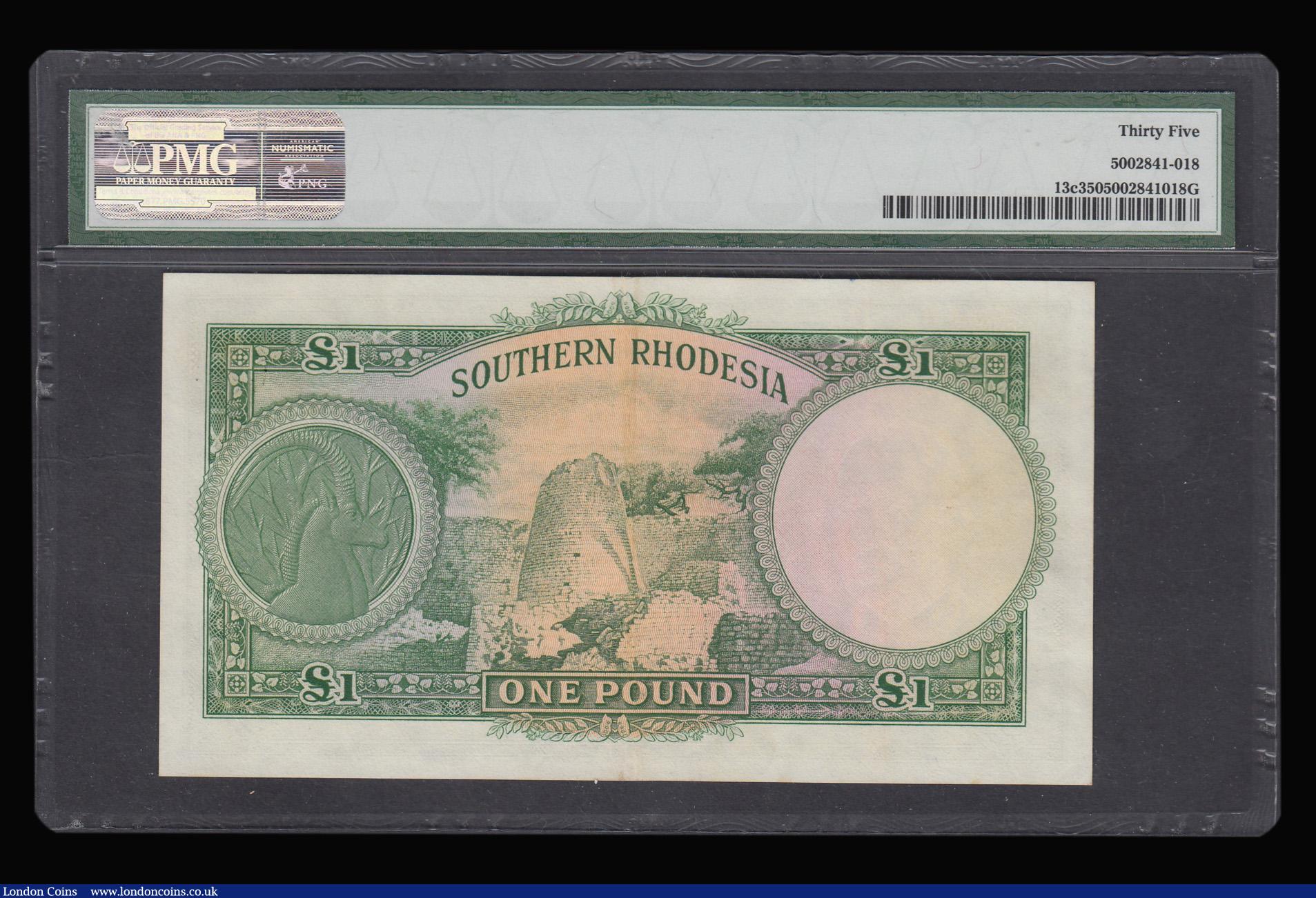 London Coins : A181 : Lot 415 : Southern Rhodesia One Pound Salisbury 10th March 1954 Pick 13c serial number B/248 083,458 PMG Choic...