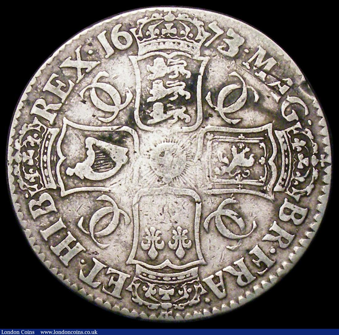 London Coins : A182 : Lot 2201 : Crown 1673 3 over 2 VICESIMO QVINTO edge, ESC 48, Bull 393 VG/approaching Fine with an edge nick and...