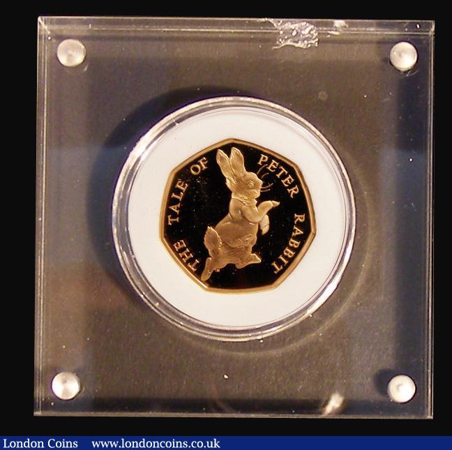 London Coins : A183 : Lot 177 : Fifty Pence 2017 Peter Rabbit Gold Proof FDC the coin in the paper weight style Perspex holder then ...