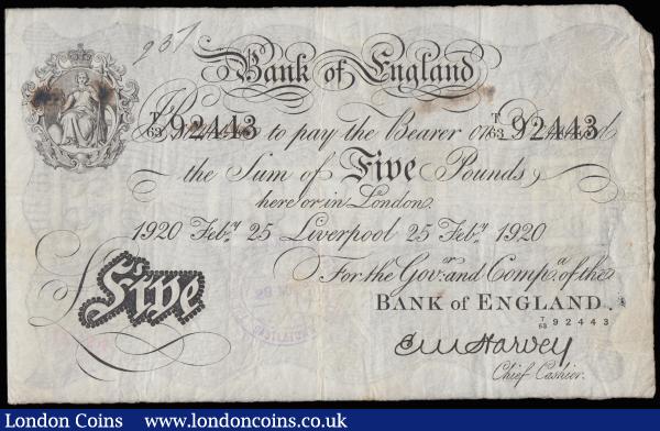 Five Pounds Harvey white B209ae dated 25th Feb 1920 series T/63 92443, a scarce LIVERPOOL branch issue, (Pick312c), Fine with bank stamps and stains and a small tear at the top : English Banknotes : Auction 185 : Lot 114