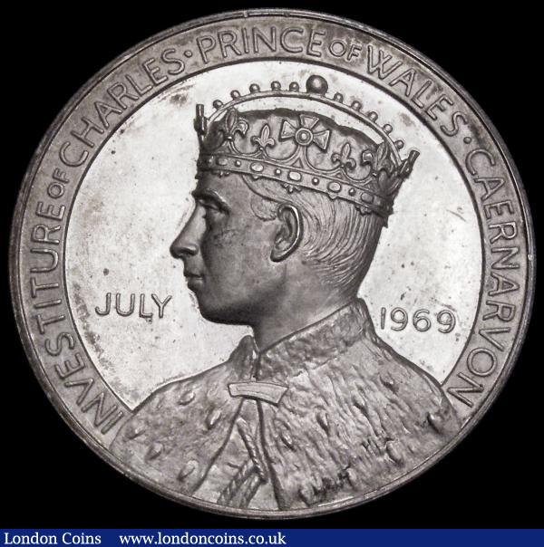 Investiture of Prince Charles as Prince of Wales 1969 39mm diameter in silver, Obverse: Bust left draped and crowned, INVESTITURE OF CHARLES  . PRINCE OF WALES. CAERNARVON JULY 1969 in the fields, Reverse: Caernarvon castle, Prince of Wales feathers and motto above, Welsh Dragon below, ARWISGIAD . SIARL TYWYSOG . CYMRU, 26.75 grammes, EF with some small areas of dark toning in places, officially numbered on the edge : Medals : Auction 185 : Lot 1292
