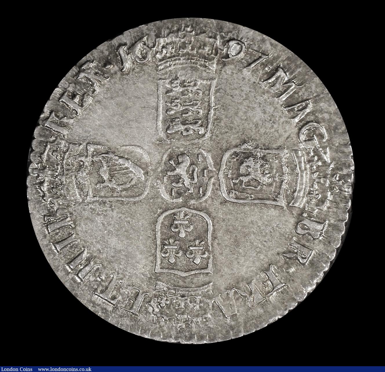 London Coins : A192 : Lot 1614 : Sixpence 1697B First Bust, Later Harp, Large Crowns ESC 1554, Bull 1261 Toned UNC in a PCGS holder a...